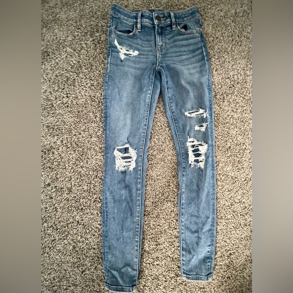 Closed ripped blue jeans